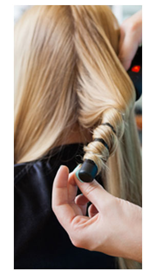 curling iron styling at the hair salon