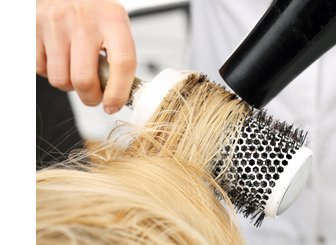 hair salon blowout styling with round brush